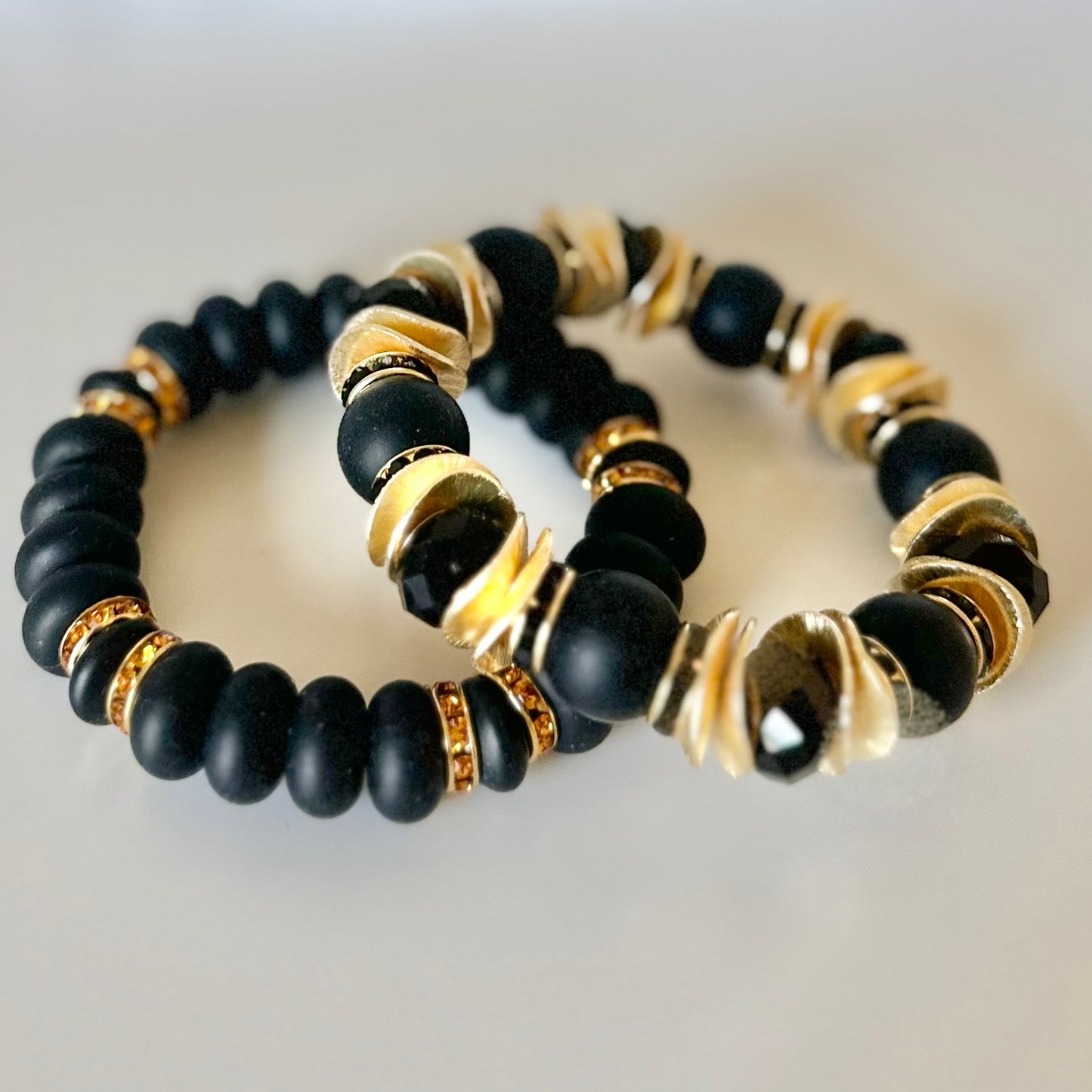 BLACK SPIRAL BANGLE WITH GOLD CZ ACCENTS